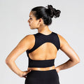 Open Back Workout Bra in Schwarz; nahtloser Sport BH mit offenem Rücken für Damen, ideal für Yoga, Pilates und low-impact Training